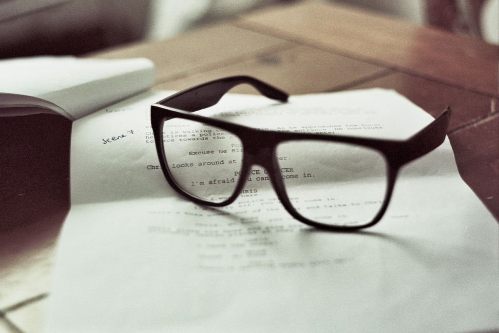 reading glasses on a script