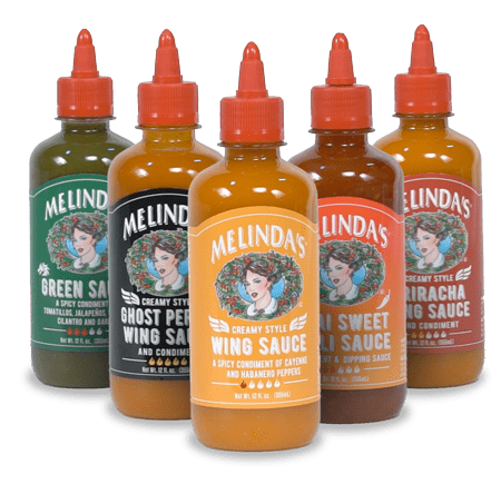 A collection of 5 of Melinda's Hot Sauce Bottle organized in a V formation.