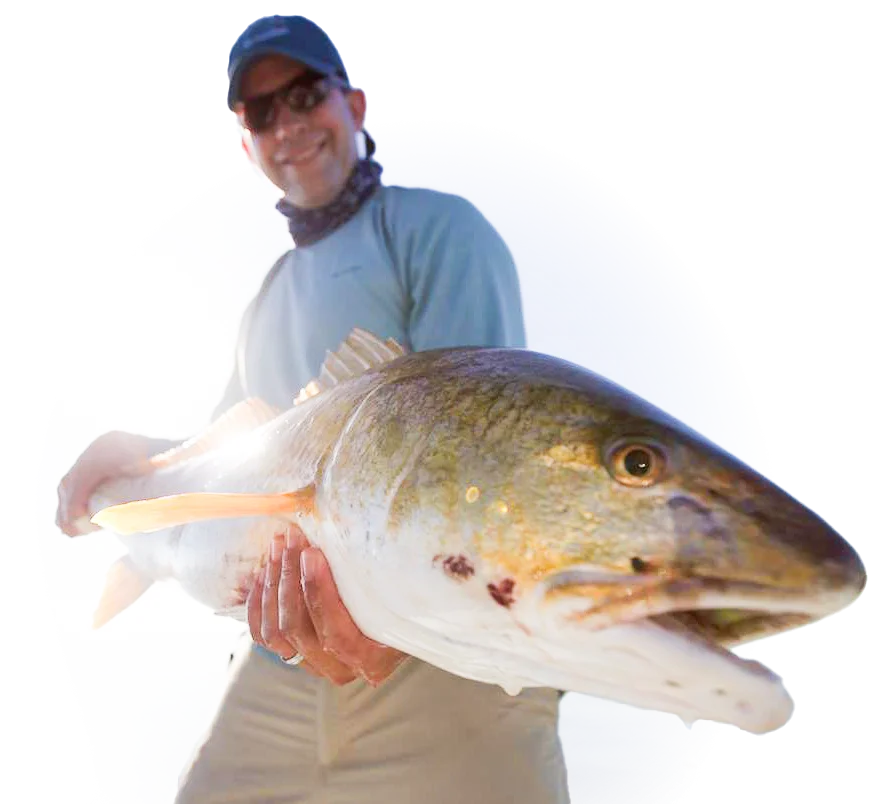 Salted Flats Fly Fishing Charter Fisherman with his Louisiana Redfish Catch in hand
