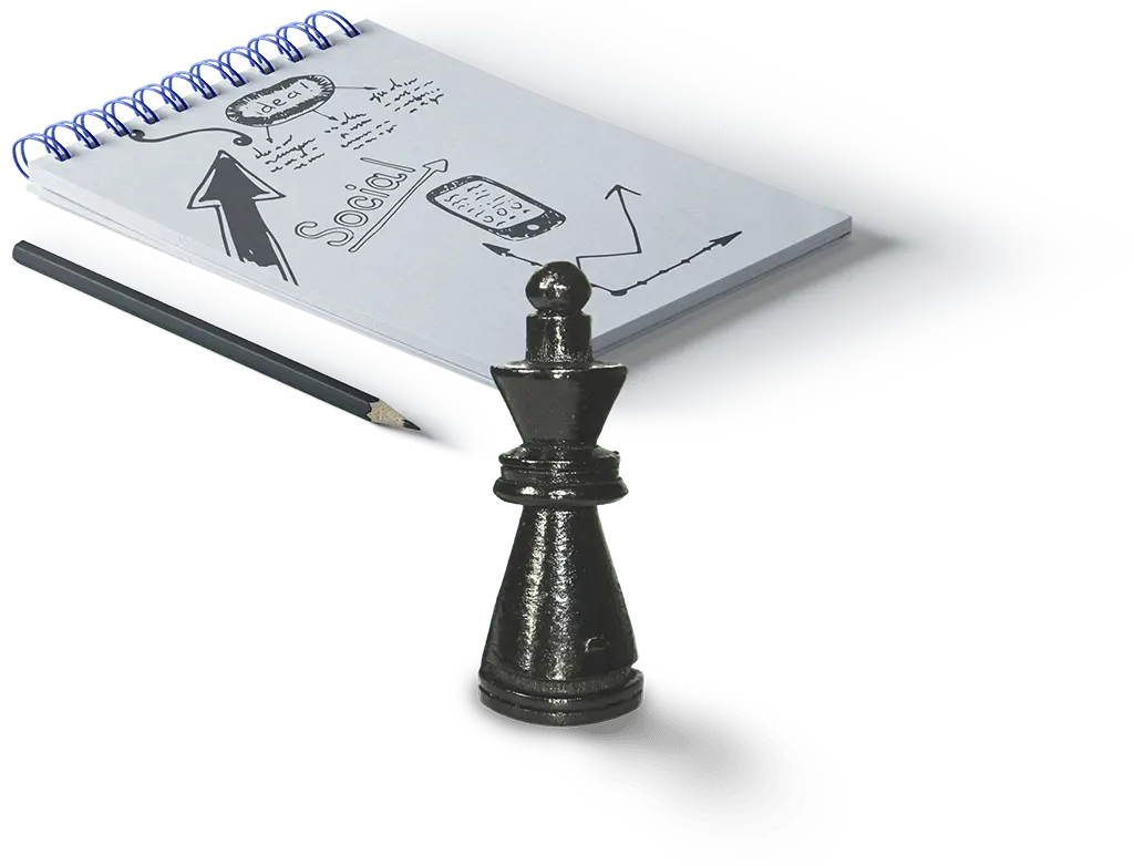 Notepad with Brand Strategies on it next to a chess piece
